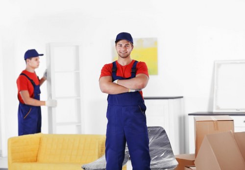 Professional packers organising household items in a Streatham property