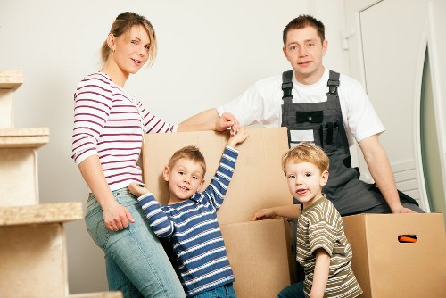 Packed boxes and furniture ready for house removals in a Streatham property