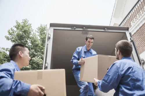 Moving boxes and household belongings being placed into a new home in Streatham